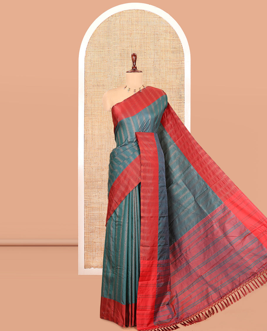 Peacock Green Semi-Soft Silk Saree, Elevated with Chevron Stripes, Complemented by a Contrast Zari Striped Border, and a Contrast Blouse