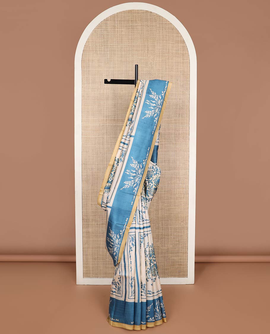 Cream with blue floral design printed silk saree with contrast border