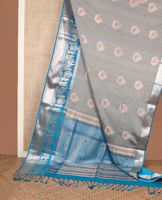 Grey zari designs soft silk saree, contrast zari border of human figurines, and pallu of intricate designs