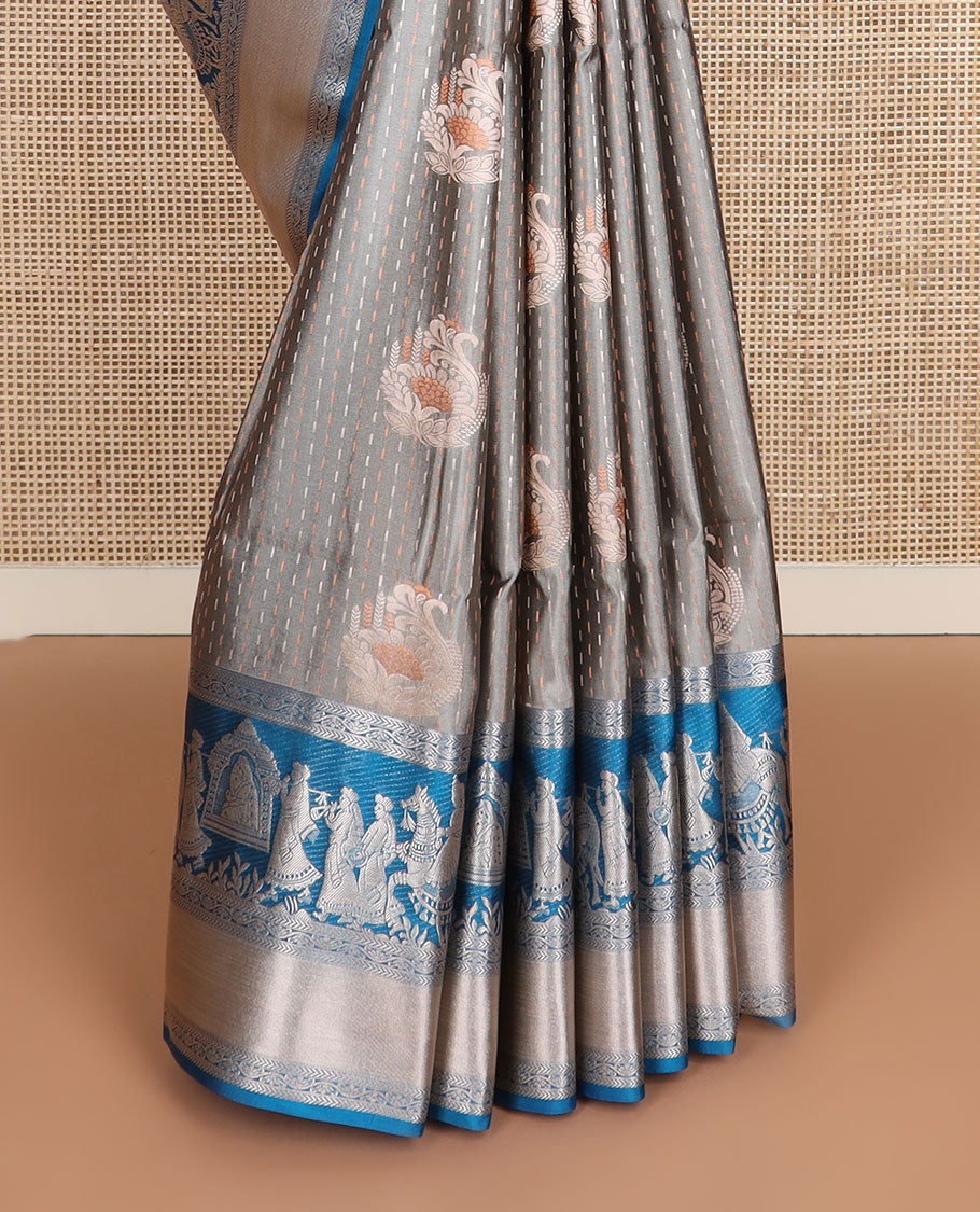 Grey zari designs soft silk saree, contrast zari border of human figurines, and pallu of intricate designs