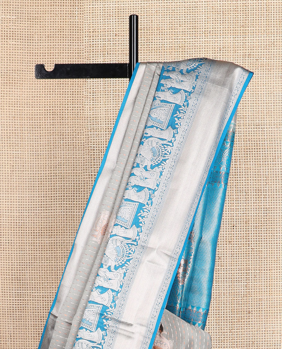 Grey zari designs soft silk saree, contrast zari border of human figurines, and pallu of intricate designs