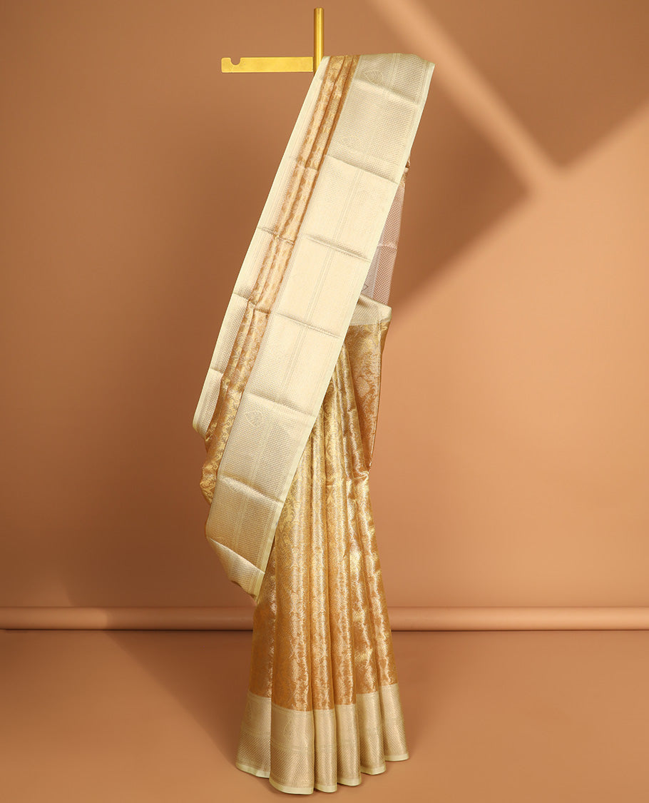 Light yellow floral jacquard semi tissue saree with contrast floral zari design border & floral design pallu