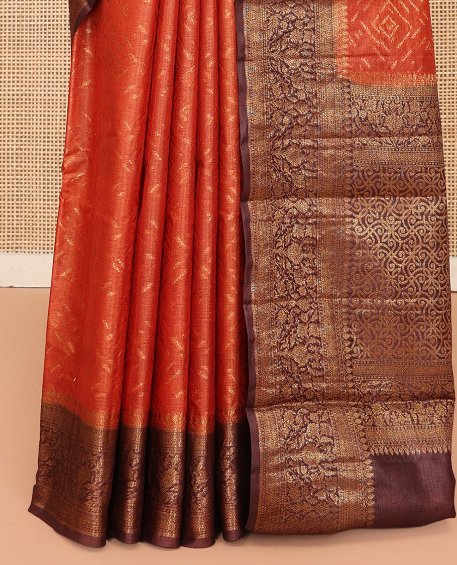 Orange Tussar Silk Saree Features Zari Designs, Complemented by a Contrast Floral Zari Border, Intricately Designed Pallu, and a Contrast Blouse