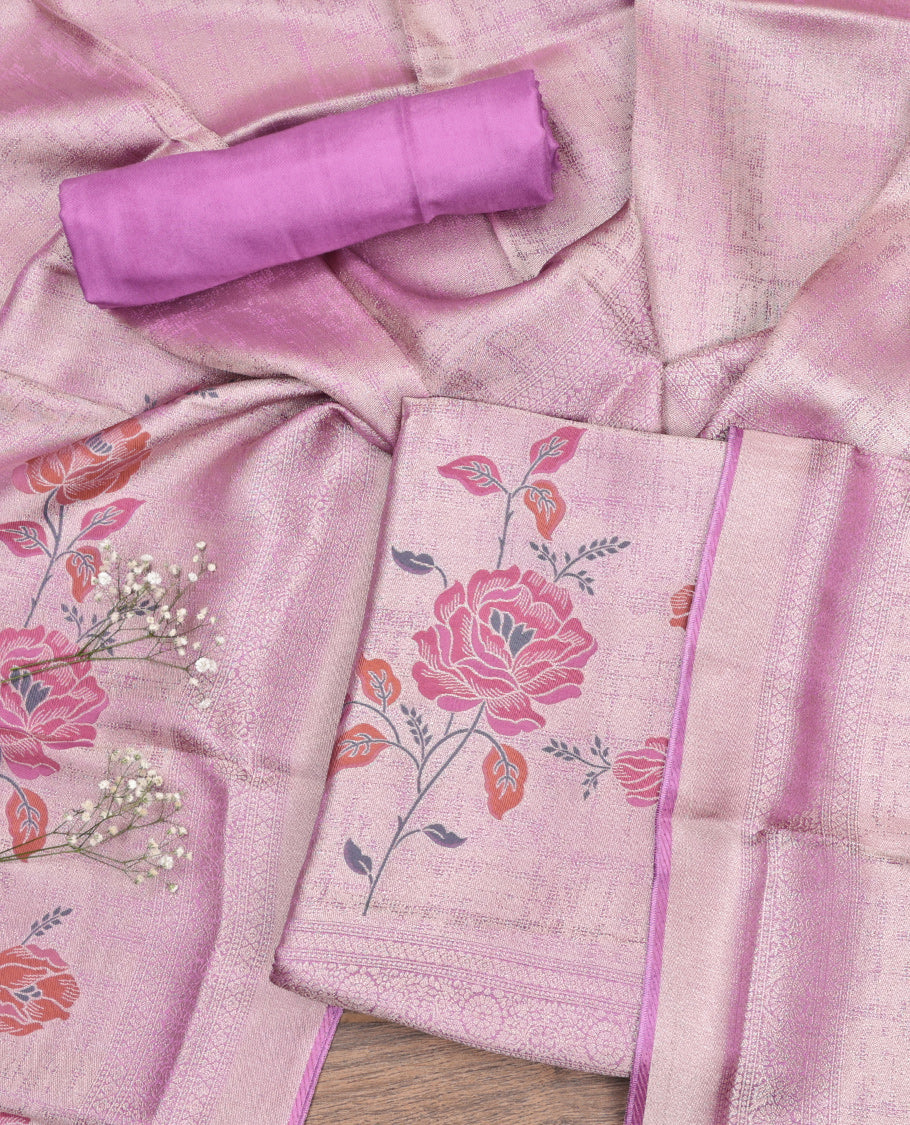 Pink Material Churidar Set, Impeccably Styled with Floral Prints on Its Banarasi-Silk Top, a Contrast Bottom, and Floral Printed Dupatta