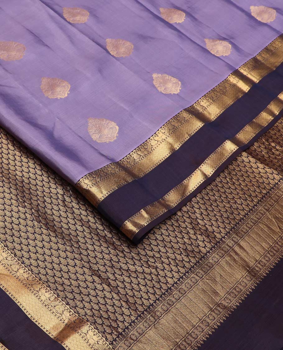 Lavender zari buttas Vasundhara silk mix saree, contrast rettai pettu border of manga, floral, and paiyaadi kattam designs, and zari design pallu