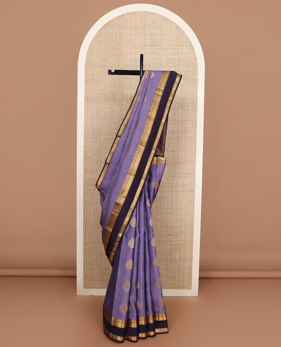 Lavender zari buttas Vasundhara silk mix saree, contrast rettai pettu border of manga, floral, and paiyaadi kattam designs, and zari design pallu