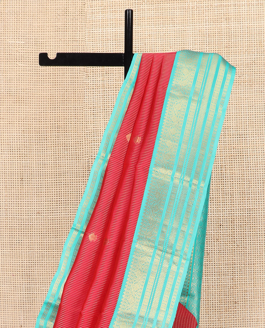 Red Vasundhara Lite Silk Mix Saree, Meticulously Crafted with Zari Buttas and Zari Stripes, Complemented by Contrast Border of Rekku, Rudraksham, Kodi Visiry, Muthu, and Kamalam Designs, Pallu Featuring Scallop Designs, and Paired with a Contrast Blouse