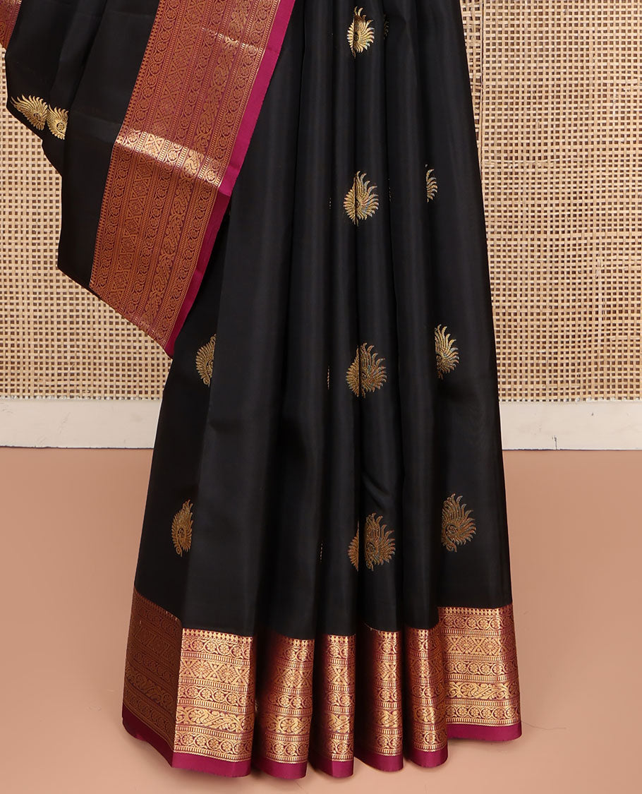 Black Vasundhara Lite Silk Mix Saree, Embellished with Zari Buttas on Its Body, Complemented by a Contrast Border of Thilakam Mokku,kodi Visiry, Muthu, Chakra, and Mayil Designs, Scallop Design Pallu, and Paired with a Contrast Blouse