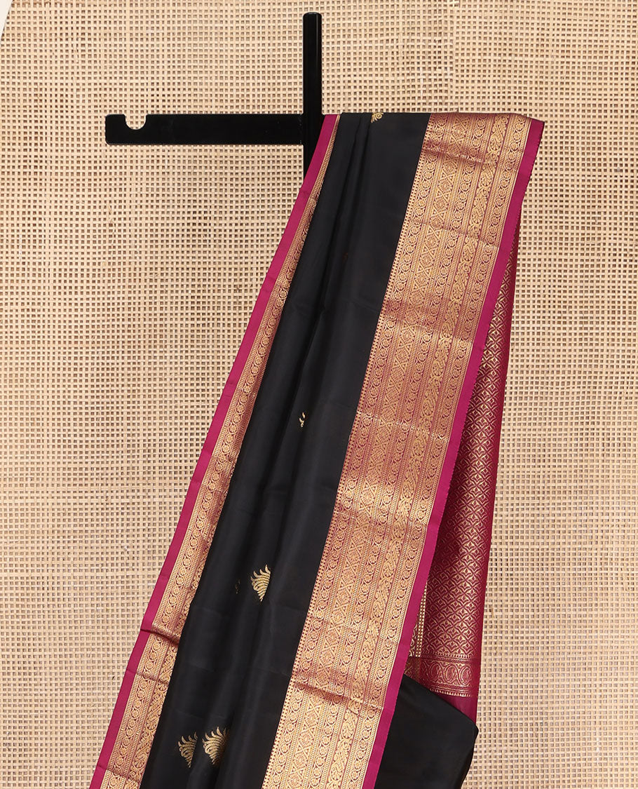 Black Vasundhara Lite Silk Mix Saree, Embellished with Zari Buttas on Its Body, Complemented by a Contrast Border of Thilakam Mokku,kodi Visiry, Muthu, Chakra, and Mayil Designs, Scallop Design Pallu, and Paired with a Contrast Blouse