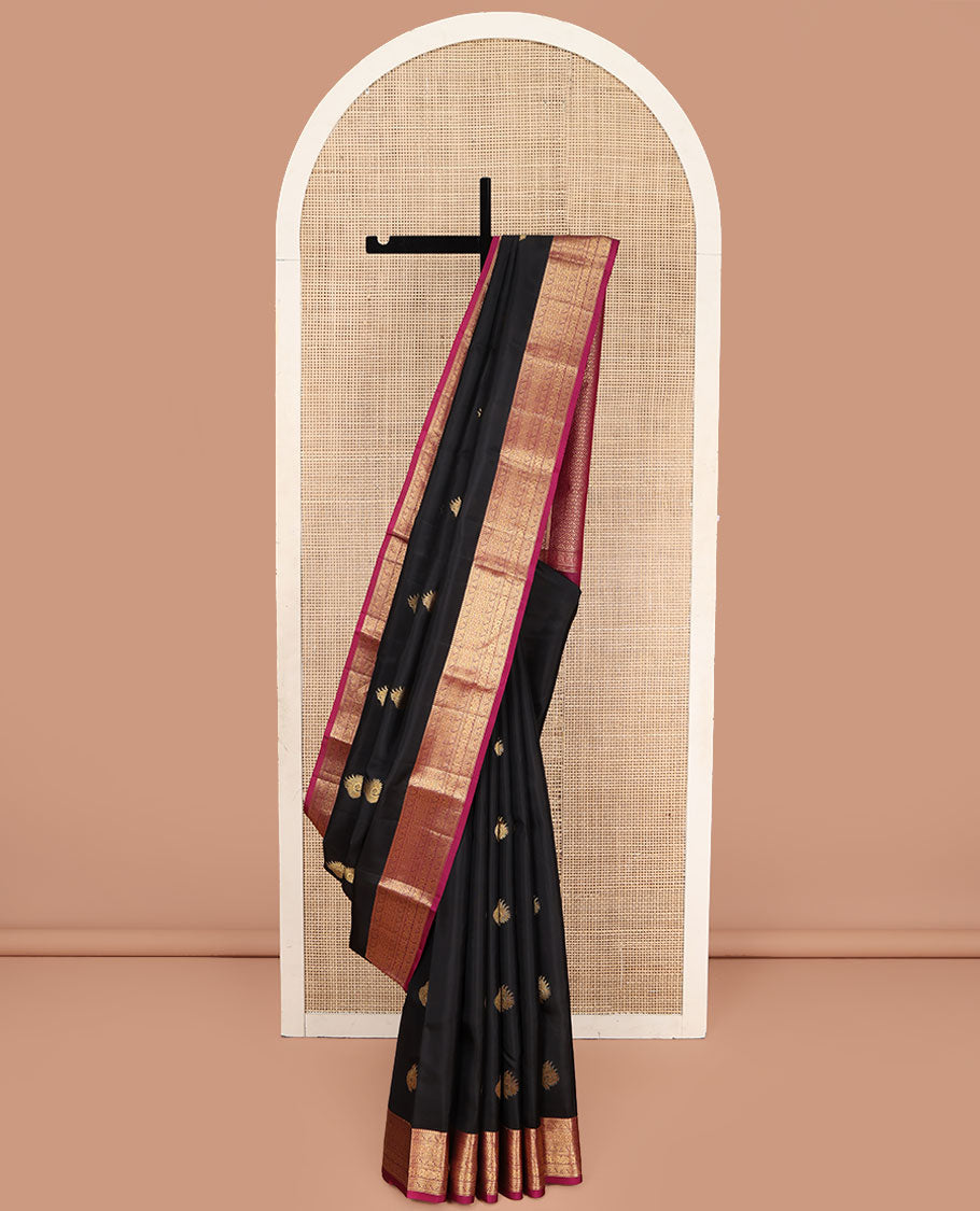 Black Vasundhara Lite Silk Mix Saree, Embellished with Zari Buttas on Its Body, Complemented by a Contrast Border of Thilakam Mokku,kodi Visiry, Muthu, Chakra, and Mayil Designs, Scallop Design Pallu, and Paired with a Contrast Blouse