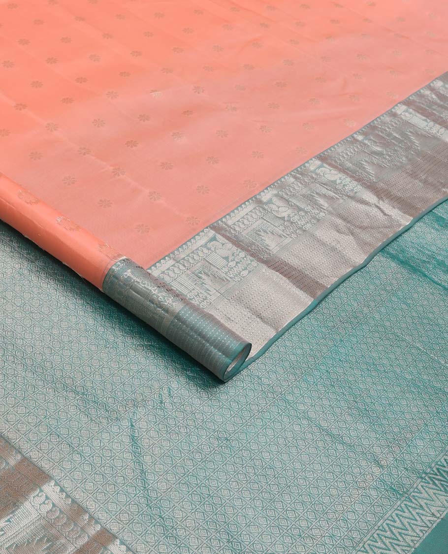 Peach zari buttas Vasundhara silk mix saree, contrast border of thilakam mokku, manga, mayil, neli, thazampoo rekku, and muthu designs, and jaal pallu
