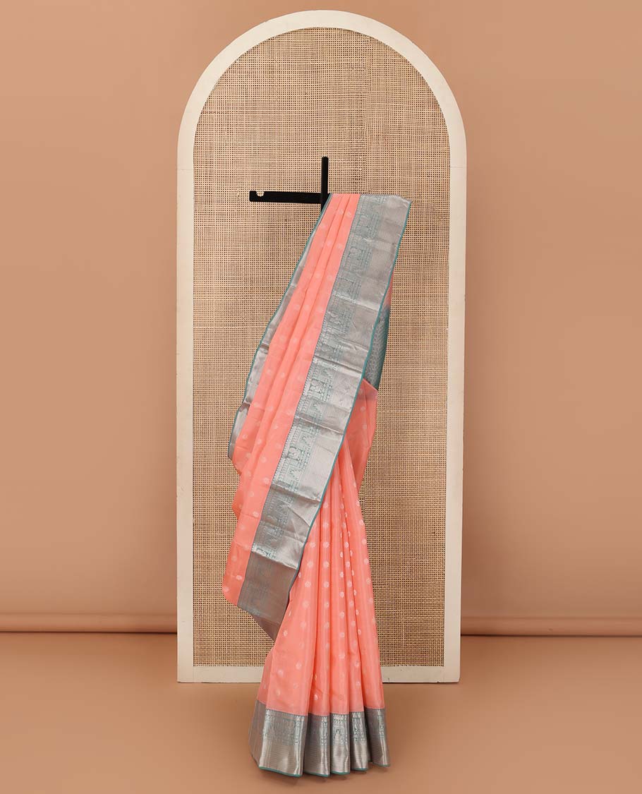 Peach zari buttas Vasundhara silk mix saree, contrast border of thilakam mokku, manga, mayil, neli, thazampoo rekku, and muthu designs, and jaal pallu