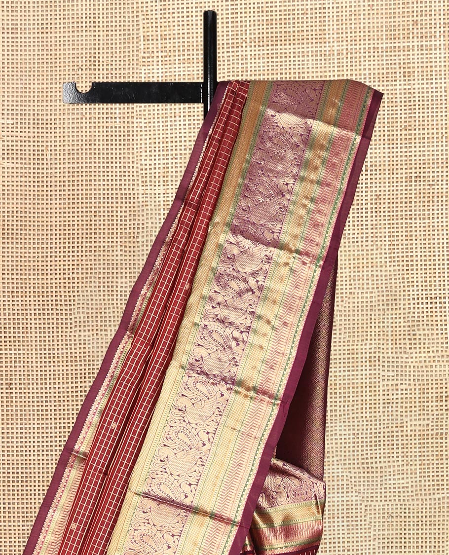 Maroon Vasundhara Lite Silk Mix Saree, Adorned with Zari Butta Enclosed Checks, a Zari Border of Rekku, Kuyil Kann, and Mayil Designs, Grand Pallu, and a Matching Blouse