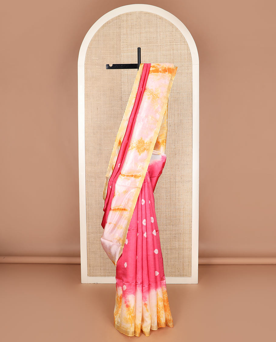 Pink shibori printed banana pith saree, contrast shibori printed border, and zari striped pallu