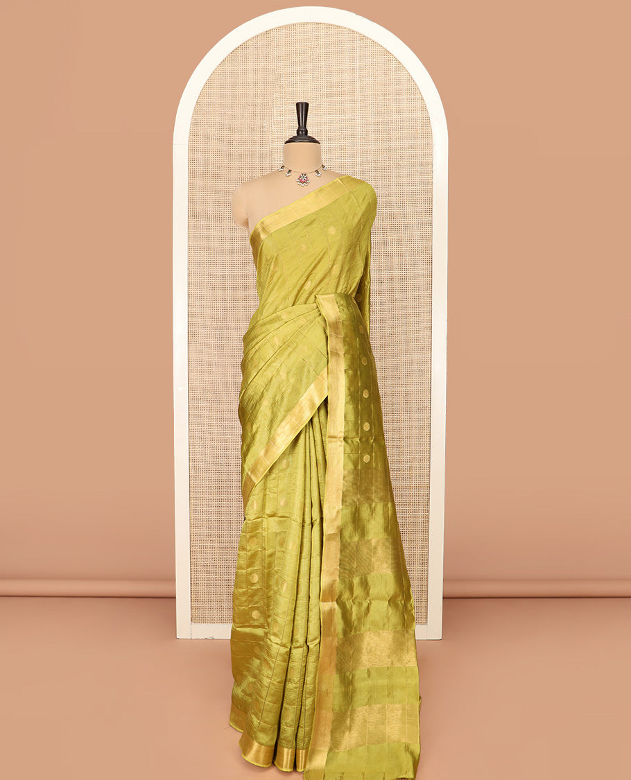 Green Banana Pith Saree Detailed with Polka Dot Buttas Enclosed Checks, Subtle Zari Border, Gleaming Zari Stripes Woven Pallu, and Paired with a Matching Plain Blouse