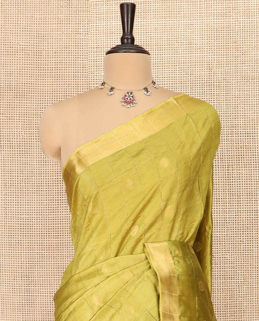 Green Banana Pith Saree Detailed with Polka Dot Buttas Enclosed Checks, Subtle Zari Border, Gleaming Zari Stripes Woven Pallu, and Paired with a Matching Plain Blouse