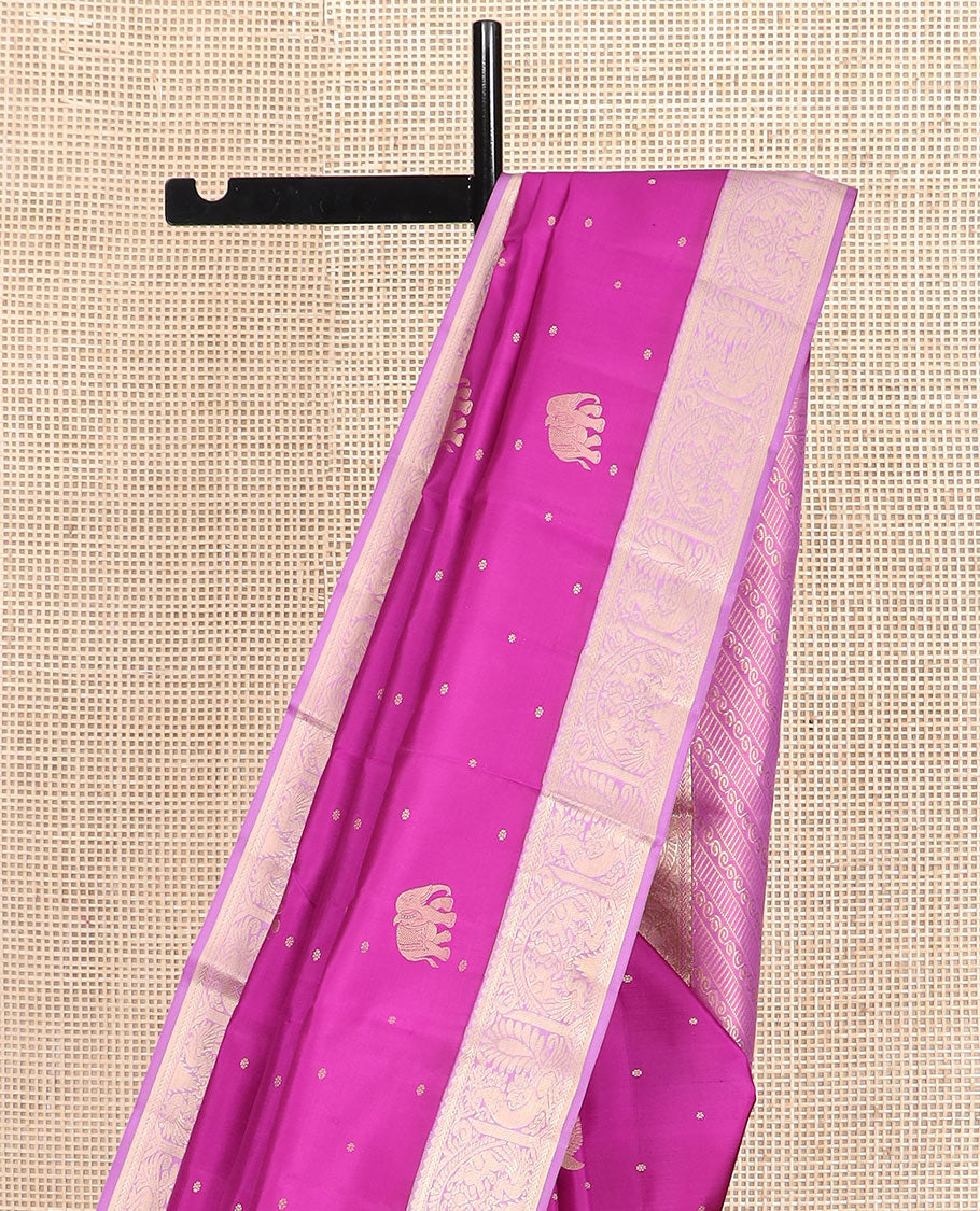Rani pink mayil and yaanai buttas silk saree, contrast border of rekku, kathir, mayil, and yaanai designs, and pallu of geometric patterns