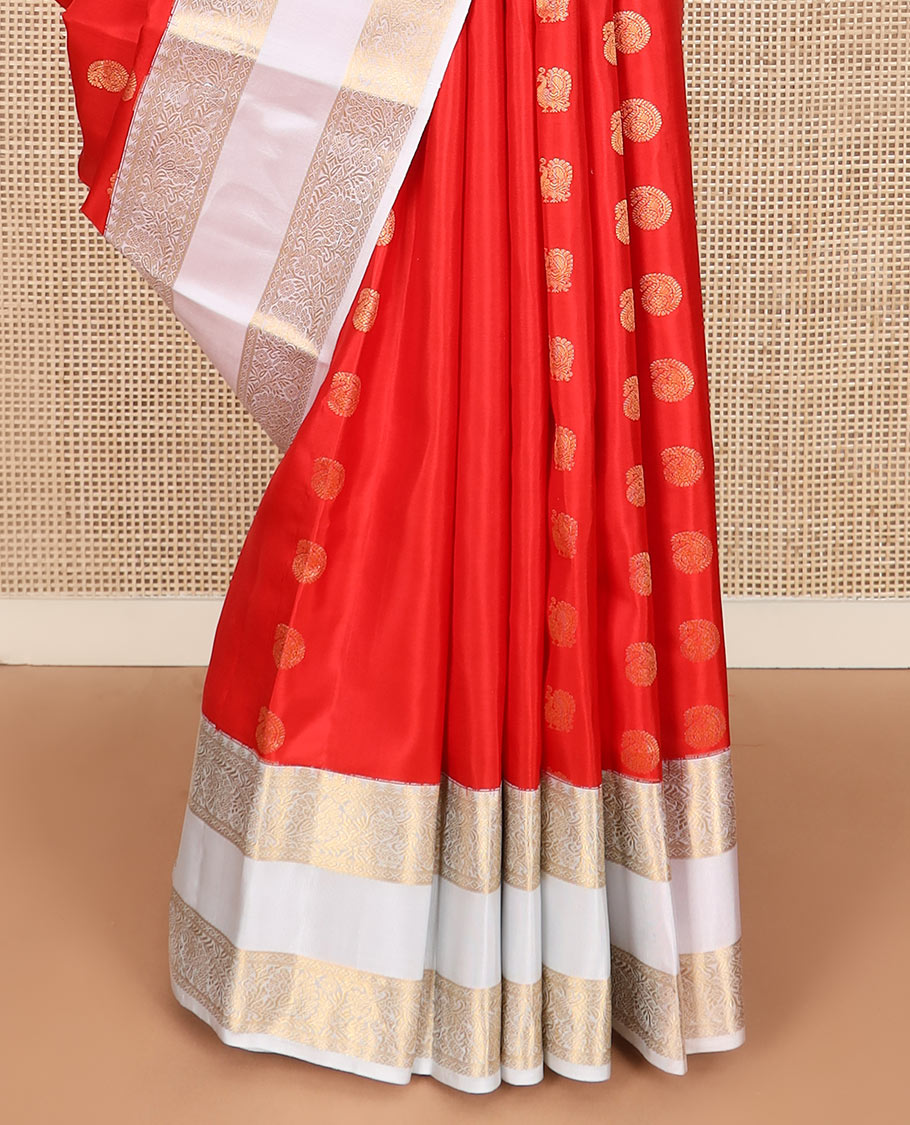 Orange arumbu manga buttas silk saree with contrast rettai pettu border of salngai, diamond, and kodi visiry designs, and intricate pallu