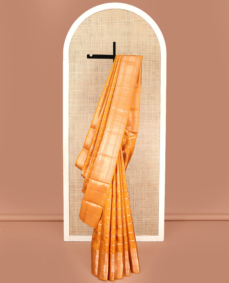 Yellow Vasundhara Silk Saree, Enriched with Zari Butta Enclosed Checked Design All Over Its Body, Highlighted by Zari Border of Thilakam Mokku, Muthu, Mayil, Yaanai, and Mayil Kann Designs, Grand Jaal Pallu, and Paired with a Matching Blouse