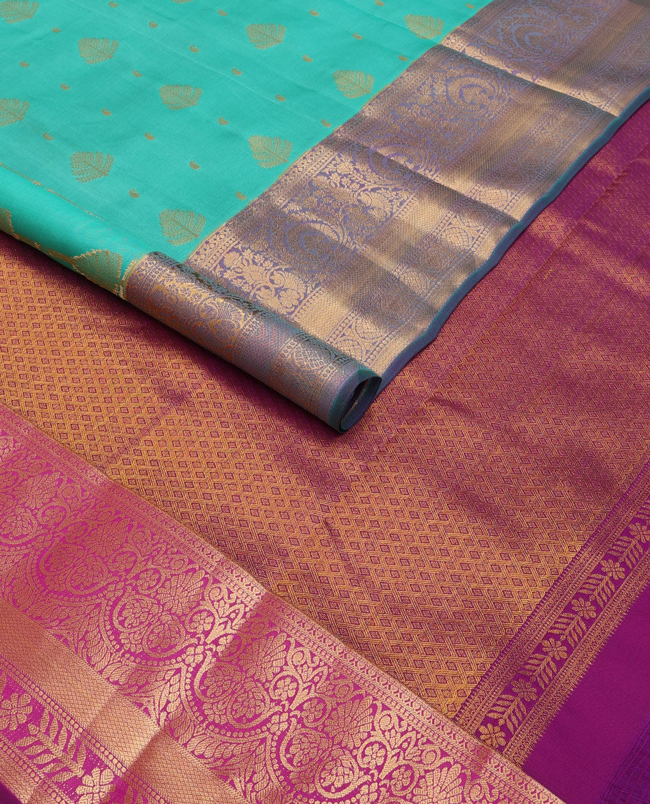 Persian green silk saree with zari buttas, contrast jaal pallu & border of floral, banaras, paisa & mayil kann designs