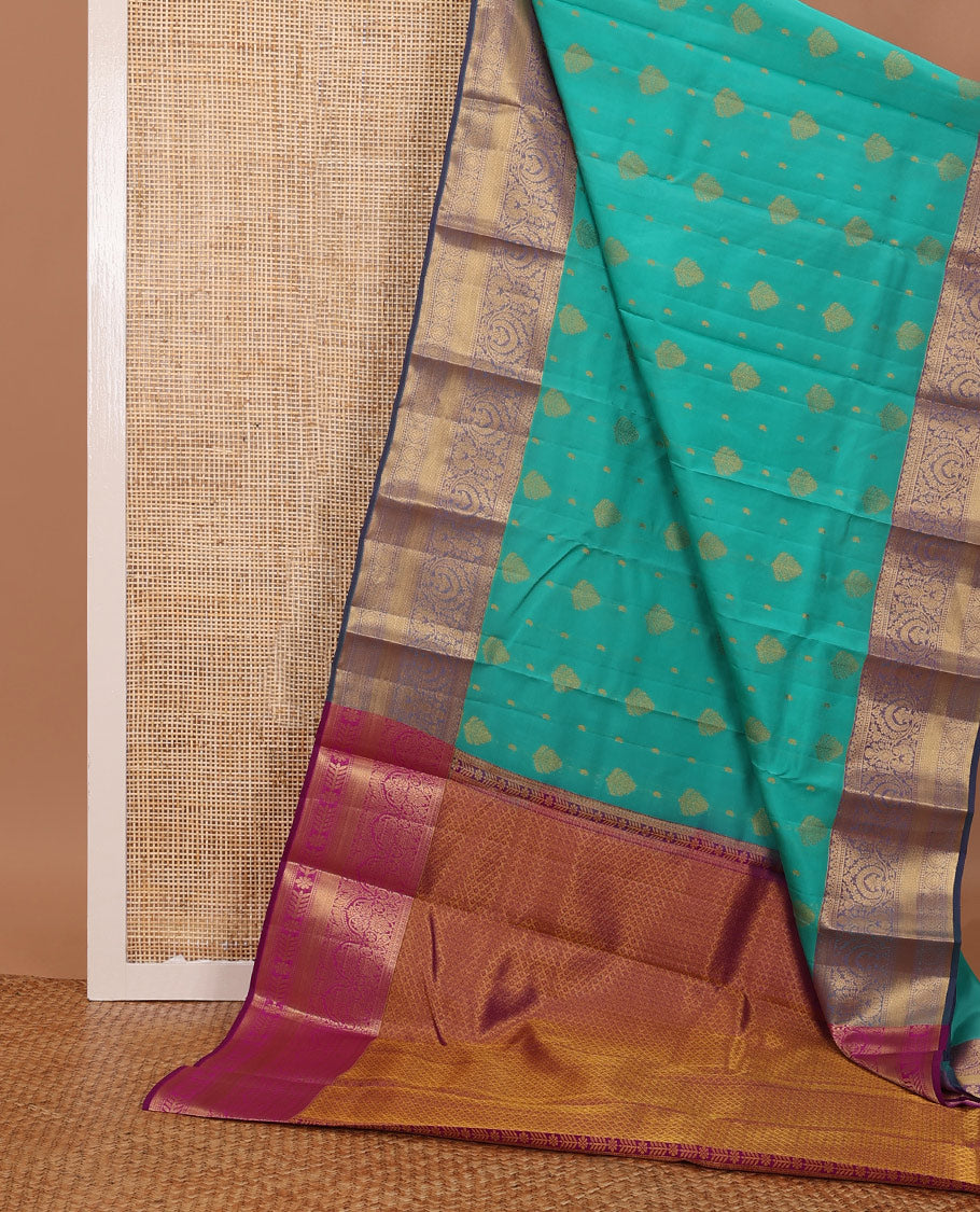 Persian green silk saree with zari buttas, contrast jaal pallu & border of floral, banaras, paisa & mayil kann designs