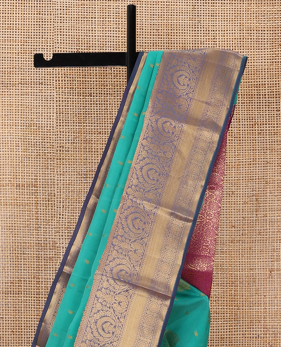 Persian green silk saree with zari buttas, contrast jaal pallu & border of floral, banaras, paisa & mayil kann designs