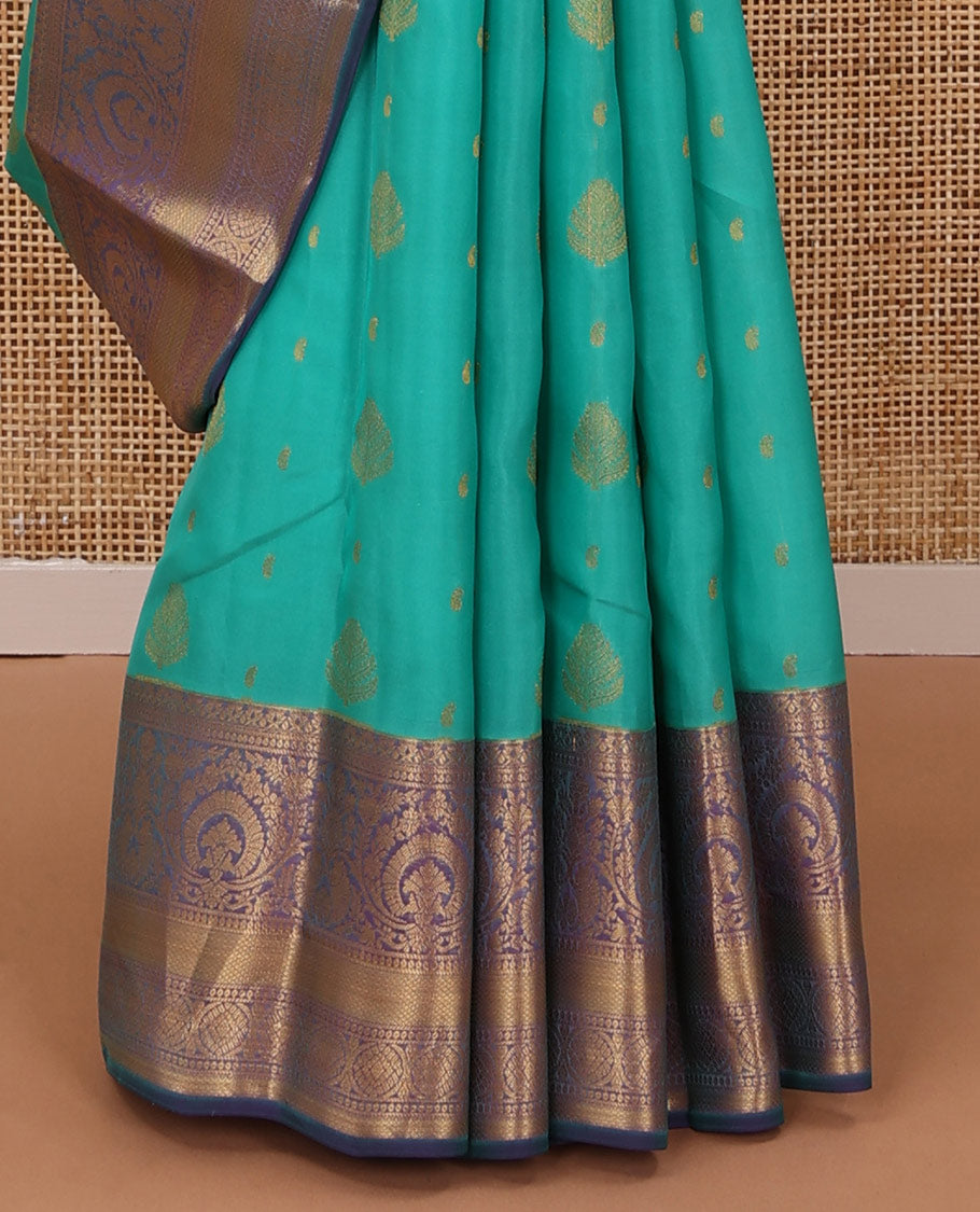 Persian green silk saree with zari buttas, contrast jaal pallu & border of floral, banaras, paisa & mayil kann designs