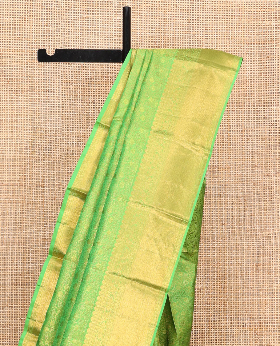 Green Kanchipuram Wedding Silk Saree, Artfully Detailed with Jacquard Designs on Its Body, Highlighted by a Zari Border of Thilakam, Rettai Neli, and Kodi Visiry Designs, Gracefully Embellished Pallu, and Paired with a Matching Blouse