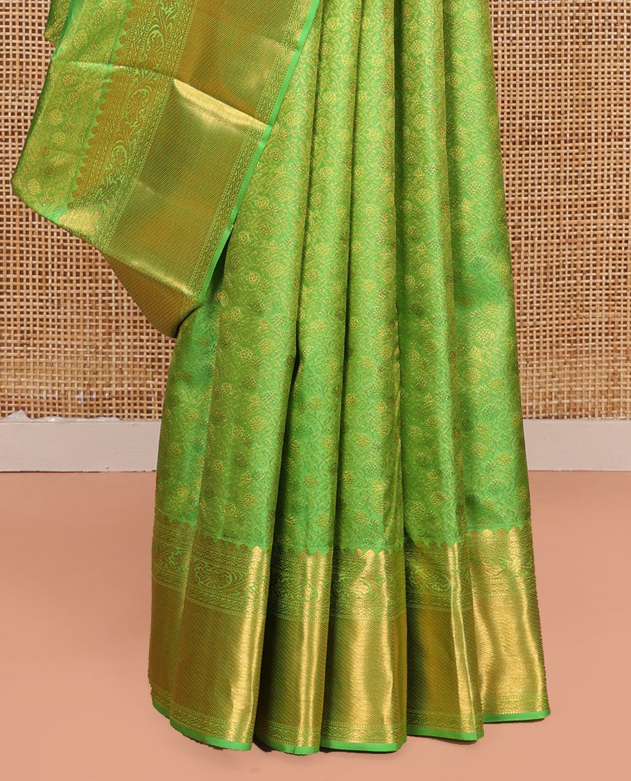 Green Kanchipuram Wedding Silk Saree, Artfully Detailed with Jacquard Designs on Its Body, Highlighted by a Zari Border of Thilakam, Rettai Neli, and Kodi Visiry Designs, Gracefully Embellished Pallu, and Paired with a Matching Blouse