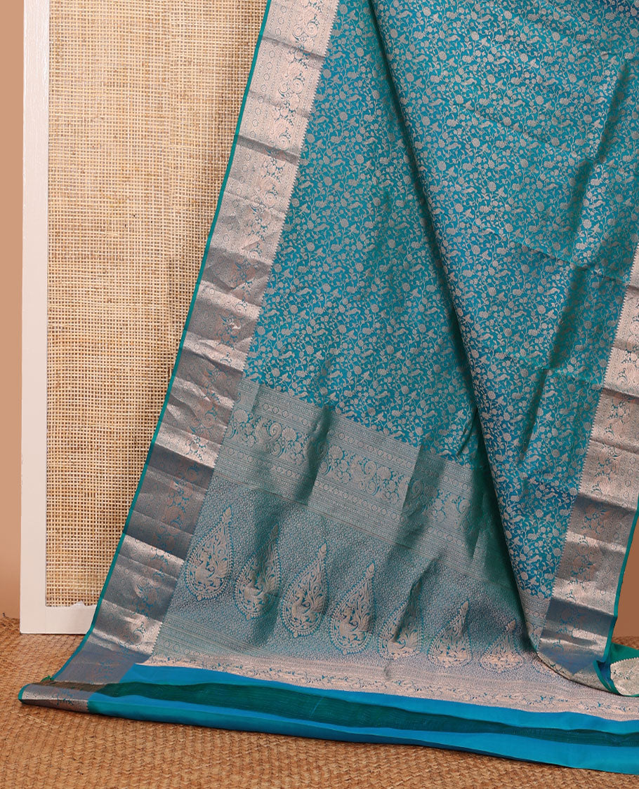 Blue vanasingari-style jacquard woven wedding silk saree, intricate pallu & border of thilakam mokku,kodi visiry,kathir,laddu kamalam & mayil