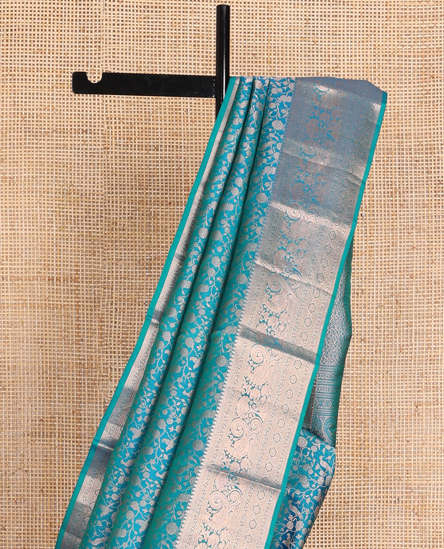Blue vanasingari-style jacquard woven wedding silk saree, intricate pallu & border of thilakam mokku,kodi visiry,kathir,laddu kamalam & mayil