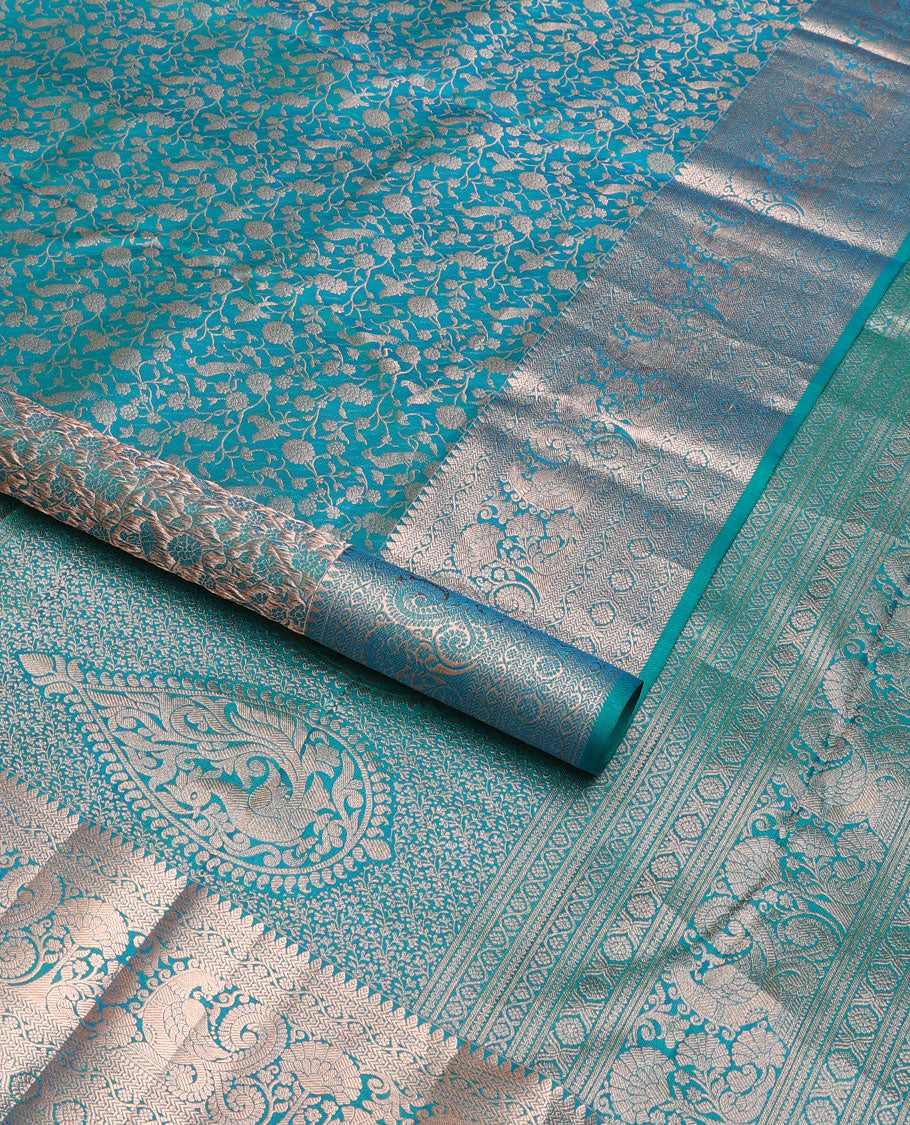 Blue vanasingari-style jacquard woven wedding silk saree, intricate pallu & border of thilakam mokku,kodi visiry,kathir,laddu kamalam & mayil