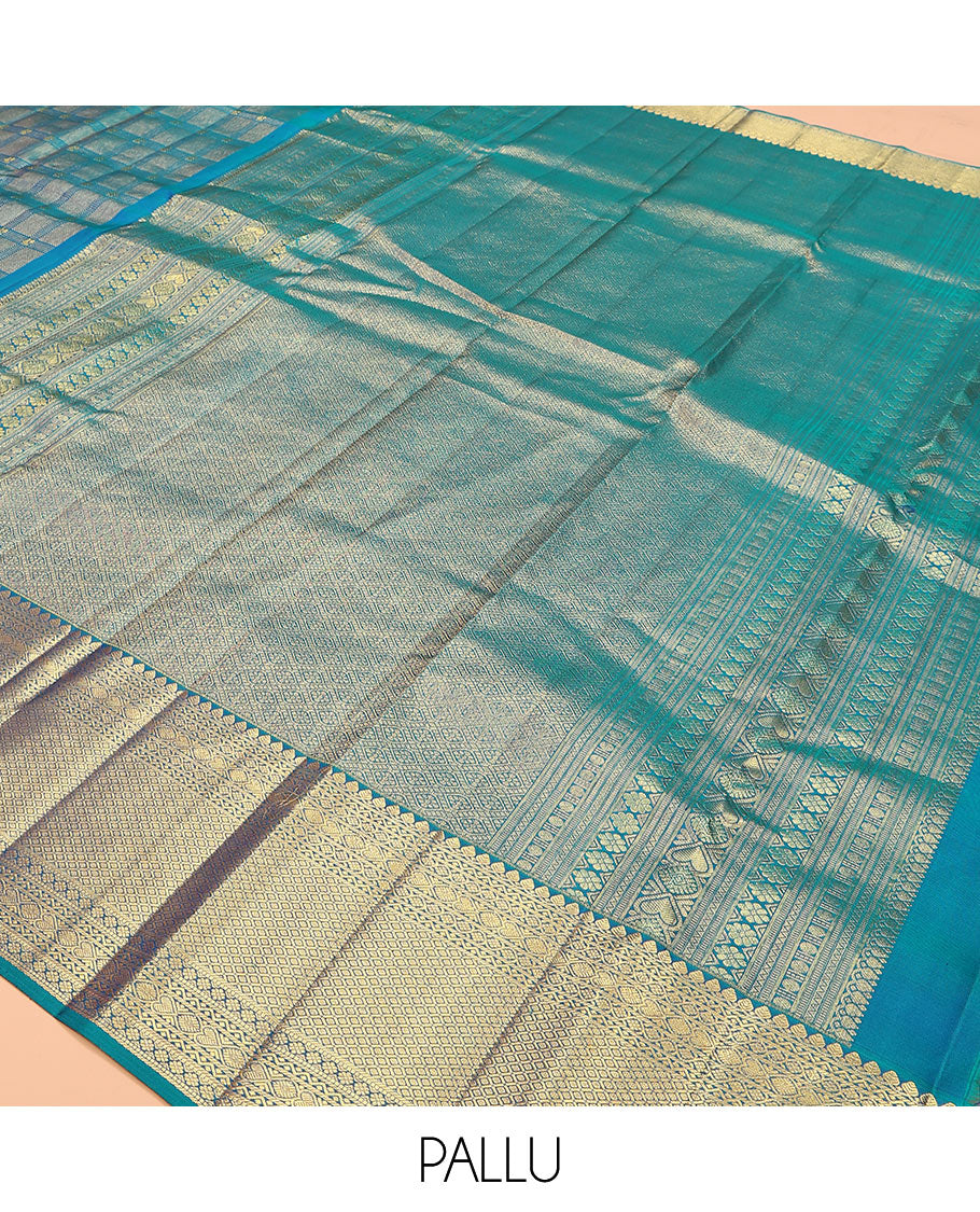 Blue jacquard kanchipuram silk saree, zari border of thilakam mokku, neli, kodi visiry, jada nagam, and jaal designs, and jaal pallu