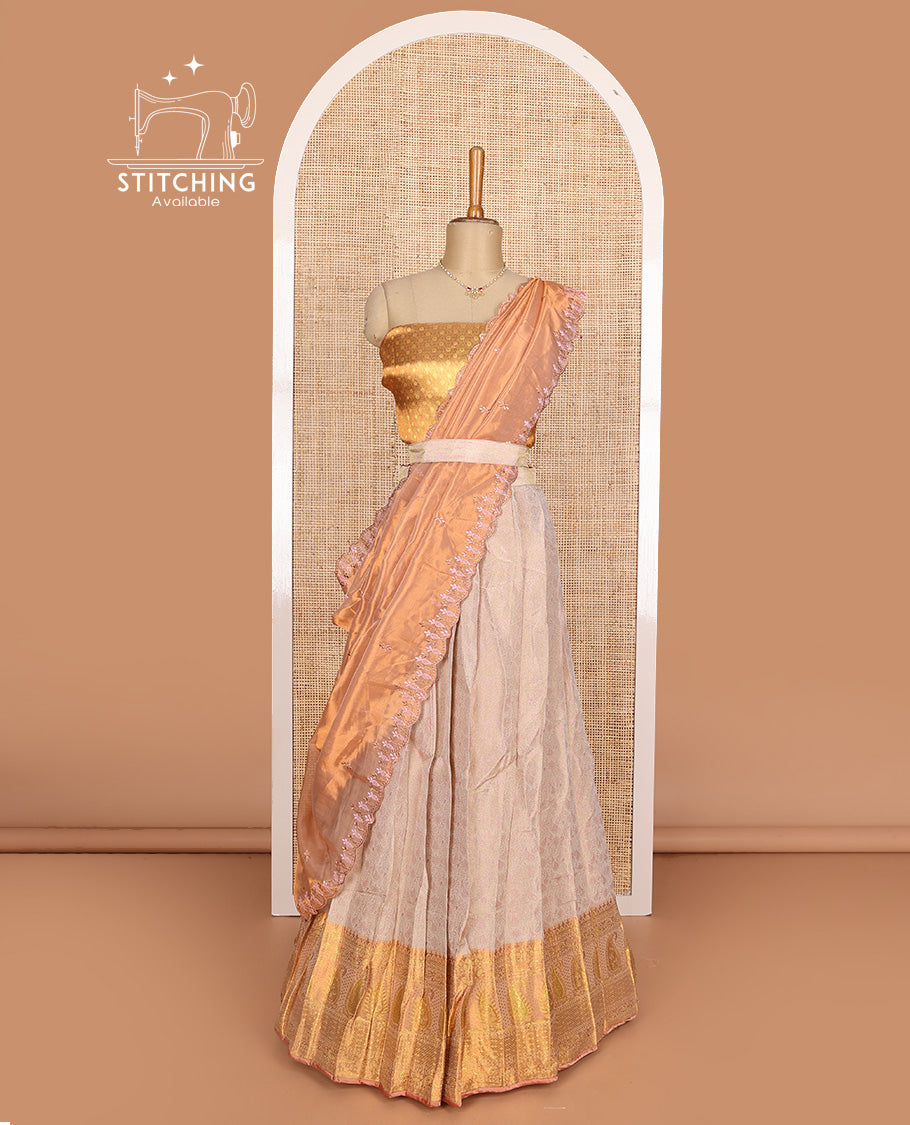 Beige art silk half-saree, brocade with contrast traditional border skirt, contrast brocade blouse, scallop embroidered dhavani, and detachable belt