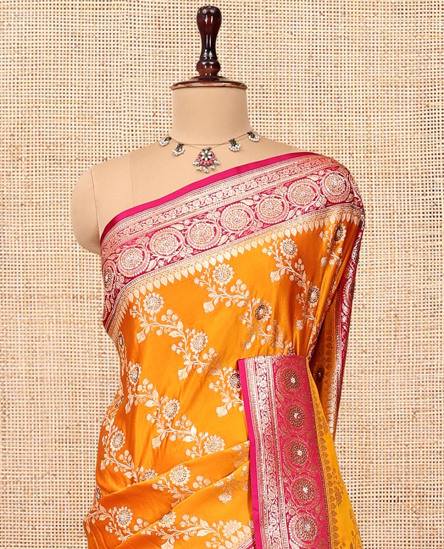 Orange Banarasi Satin Saree, Mesmerized with Floral Jaal Jacquard, a Contrast Floral Creeper Border, Intricate Stonework Pallu, and a Contrast Blouse