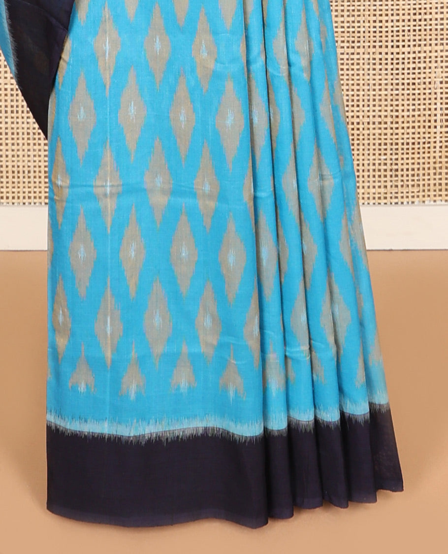 Light blue geometric design ikkat cotton saree with contrast border & argyle design pallu