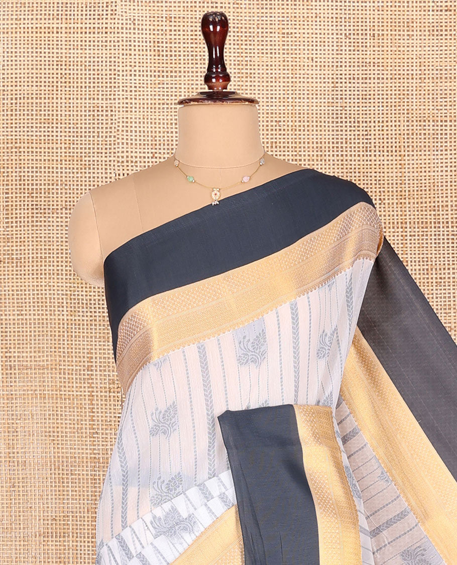 Grey Semi-Silk Cotton Saree, Embellished with Buttas and Stripes All Over Its Body, Complemented by a Contrast Traditional Zari Design Border, Pallu of Jaal Designs, and Paired with a Matching Blouse