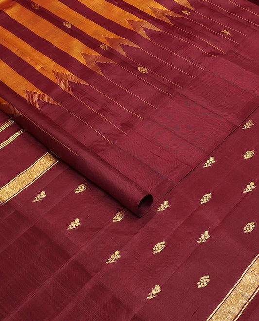 Maroon & yellow striped Kanchipuram silksaree with zari buttas, one-sided temple border & zari woven pallu