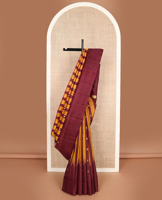 Maroon & yellow striped Kanchipuram silksaree with zari buttas, one-sided temple border & zari woven pallu