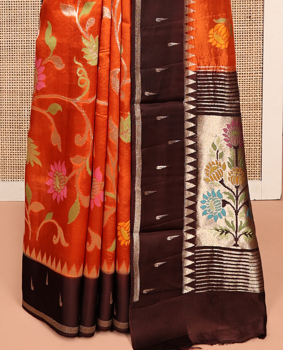 Orange Matka Silk Saree, Spotlighted with Meenakari Floral Vine All Over Its Body, Complemented by a Contrast Border of Traditional and Muniya Designs, Pallu of Floral Designs, and Paired with Contrast Blouse