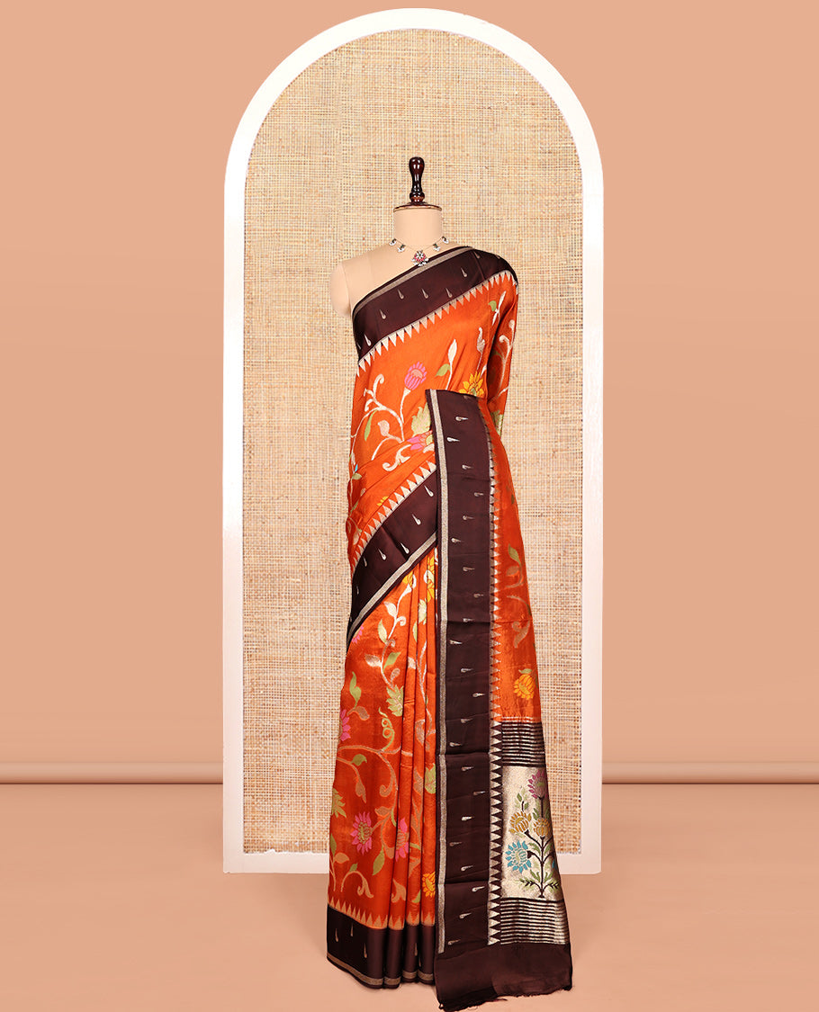 Orange Matka Silk Saree, Spotlighted with Meenakari Floral Vine All Over Its Body, Complemented by a Contrast Border of Traditional and Muniya Designs, Pallu of Floral Designs, and Paired with Contrast Blouse