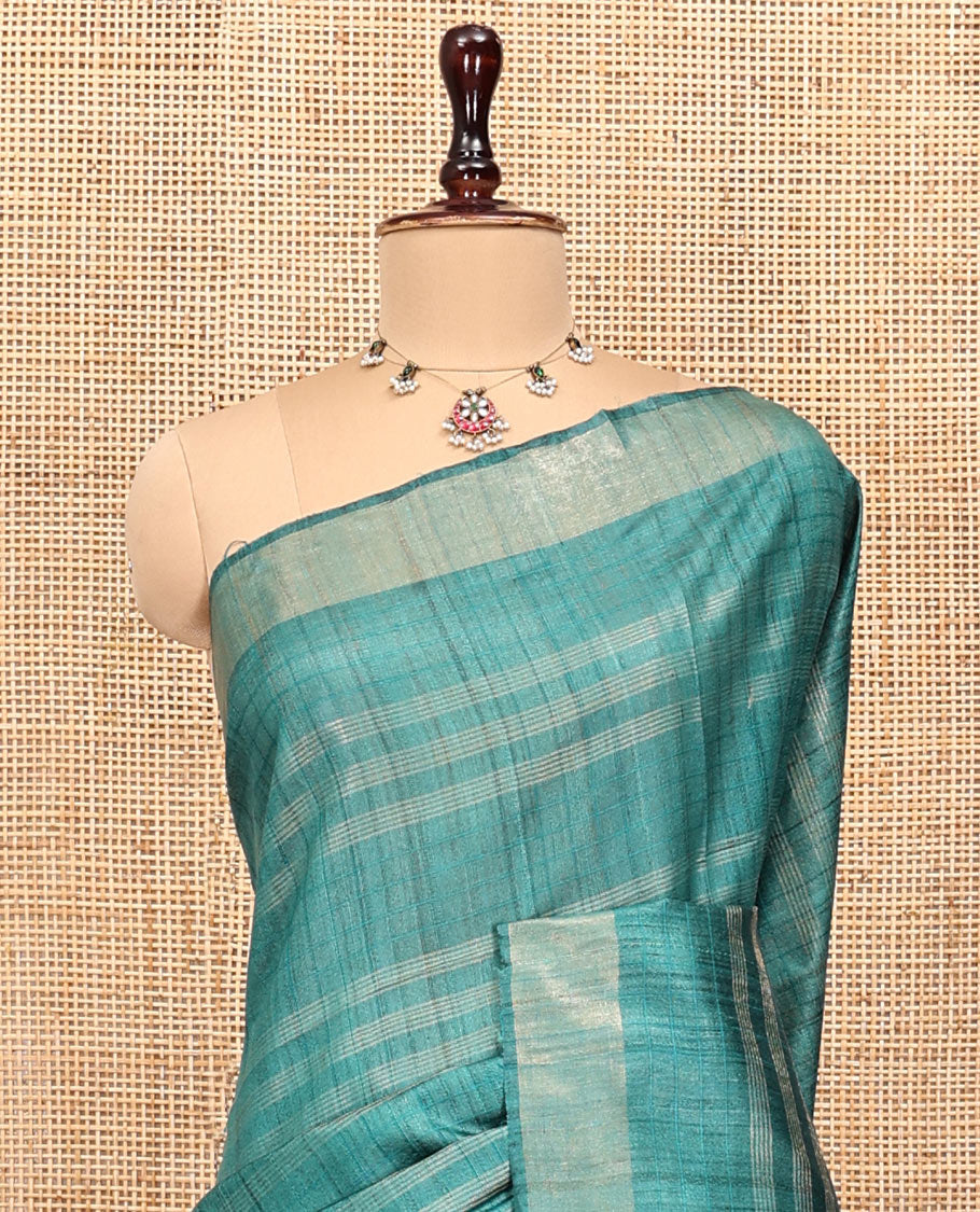 Green Tussar Silk Saree, Sparsely Threaded with Stripes, a Subtle Border, a Self-Pallu, and a Matching Blouse