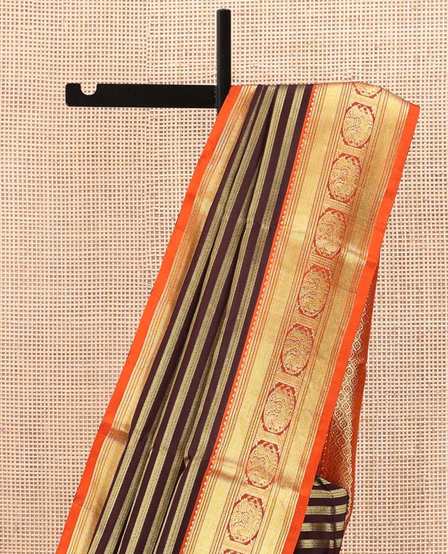 Brown Venkatagiri Silk Saree, Bedecked with Zari Stripes All Over Its Body, Complemented by a Contrast Traditional Zari Border of Round Peacock Designs, Jaal Design Pallu, and Paired with a Contrast Blouse