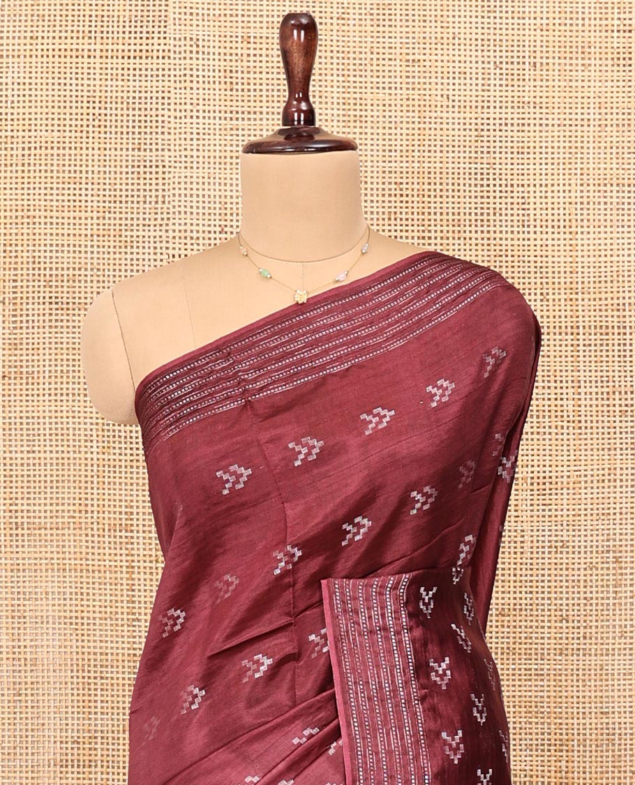Maroon Banana Pith Saree, Finely Crafted with Buttas All Over Its Body, Subtle Self-Border of Stripes and Buttas, Pallu Steeped with Stripes, and Paired with a Matching Blouse