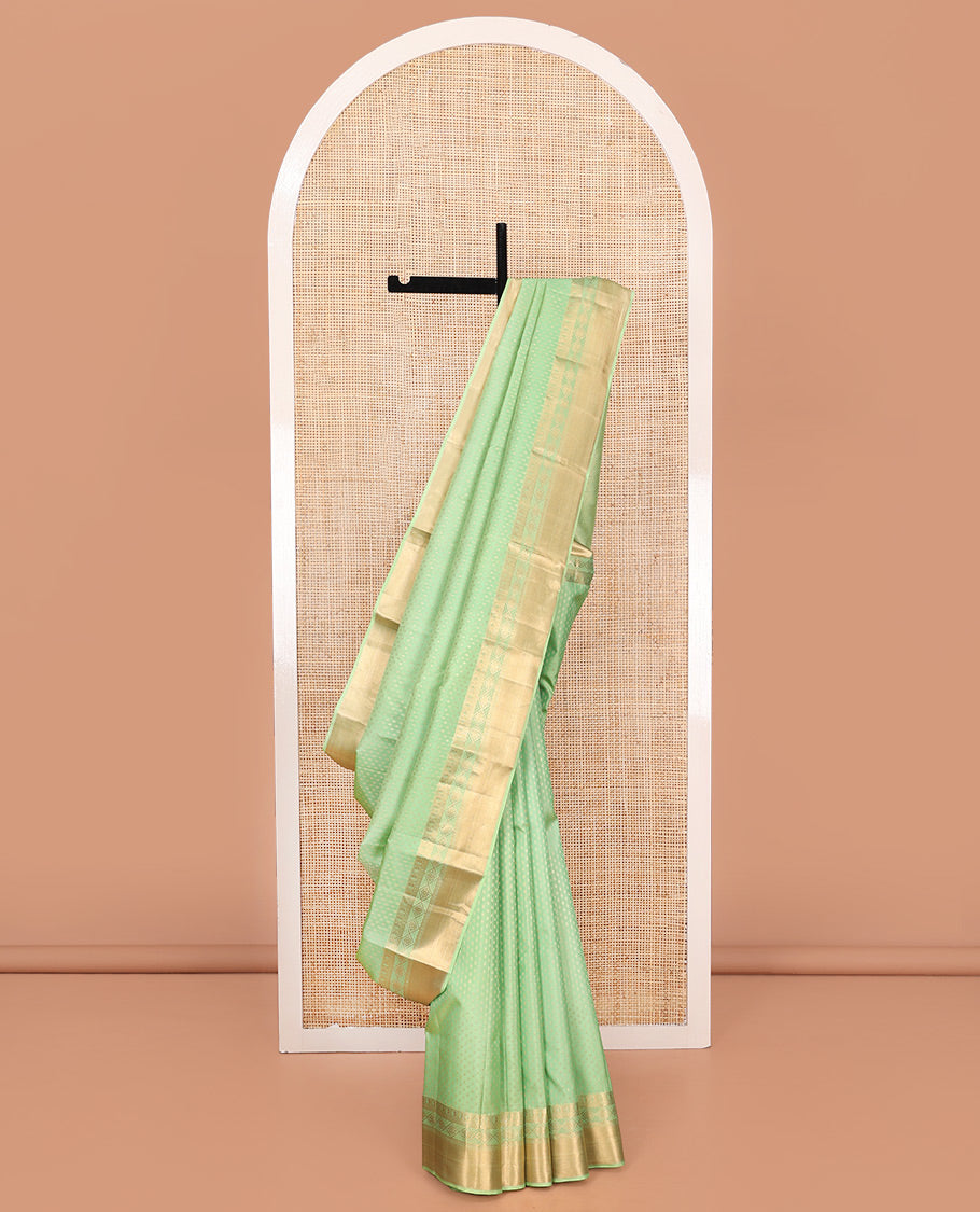 Green Vasundhara Silk Saree, Steeped with Zari Buttas on Its Body, Highlighted by a Zari Border of Traditional Designs, Richly Woven Jaal Pallu, and Paired with a Matching Blouse