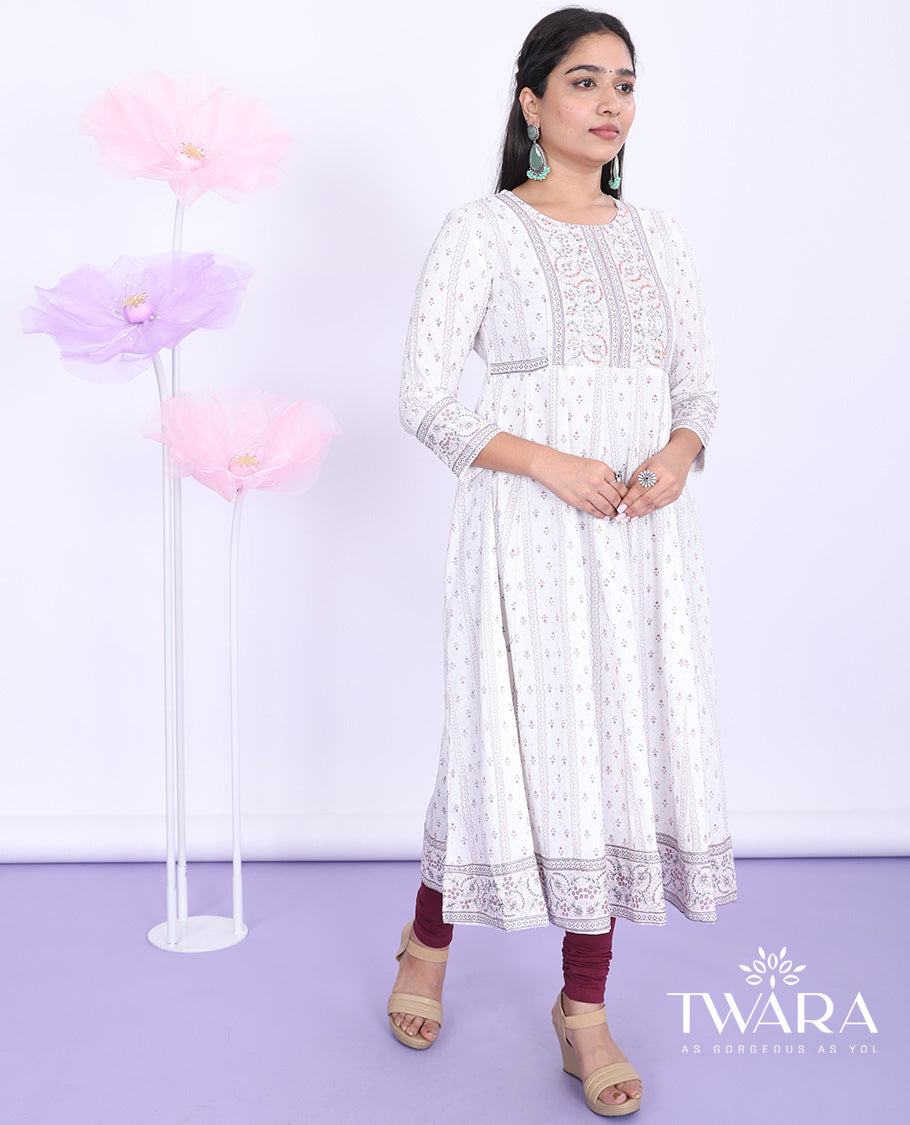 Twara cream unique motifs printed round neck with 3/4th sleeve cotton straight-cut below-knee kurti