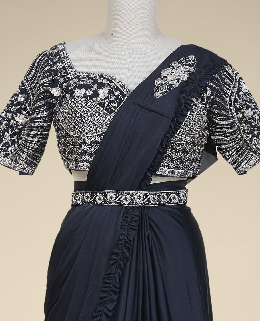 Black plain frilled readymade satin saree with frilled border & intricate embroidery sweetheart neck elbow sleeve blouse