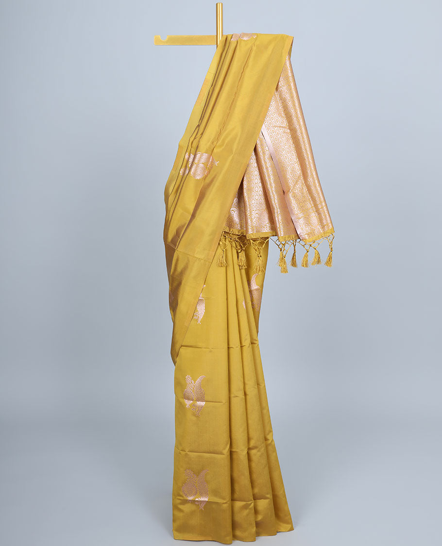 Borderless yellow butter silk saree with zari buttas, self-pallu of ogee patterns