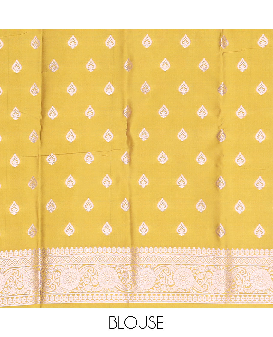 Borderless yellow butter silk saree with zari buttas, self-pallu of ogee patterns