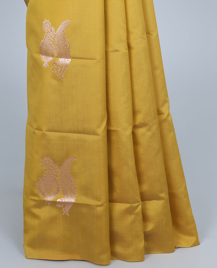 Borderless yellow butter silk saree with zari buttas, self-pallu of ogee patterns